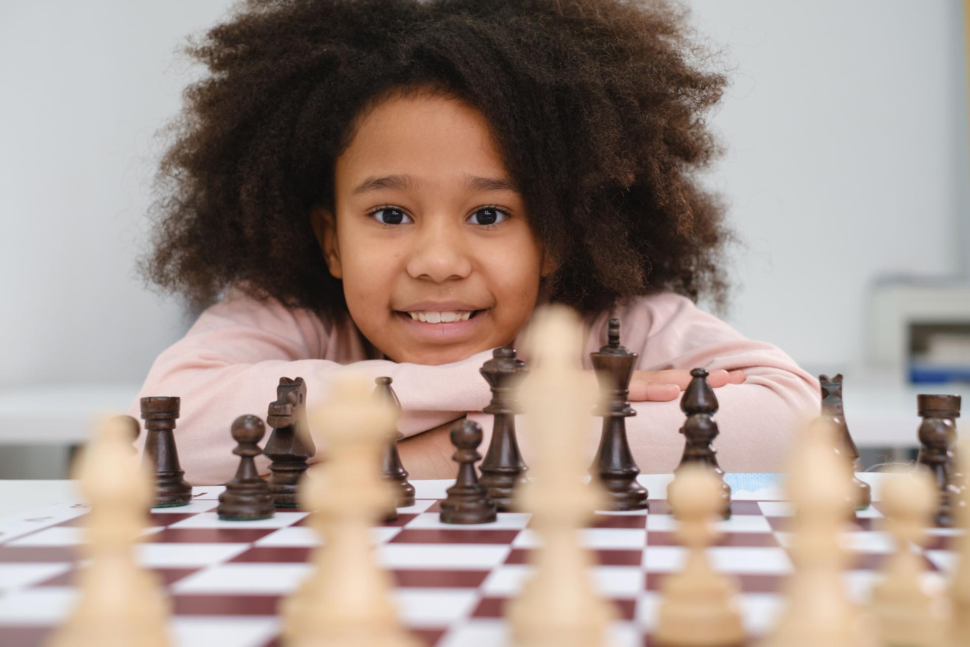 African American girl playing chess
